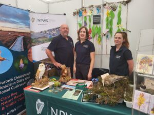 Staffs are standing beside table at Tullamore show